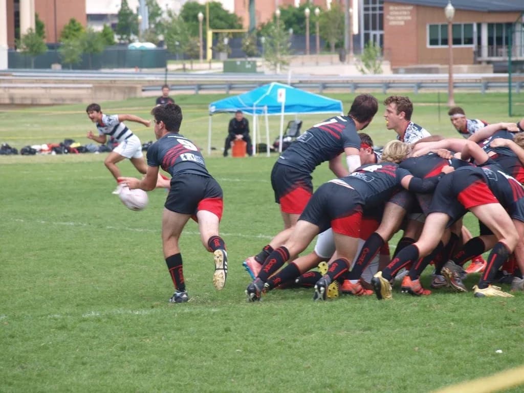 A Lake Travis player clears the ball from the back of a scrum.